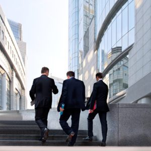 three businessmen walking
